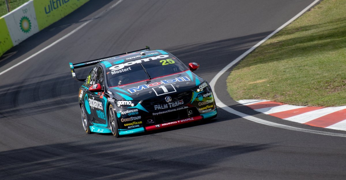 A race car navigating a corner on the Mount Panorama circuit at Bathurst, New South Wales